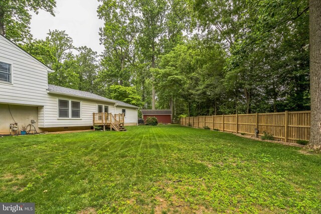 5 Kings House Ct, Silver Spring, MD 20905 - view of yard featuring a deck and view of wooded area
