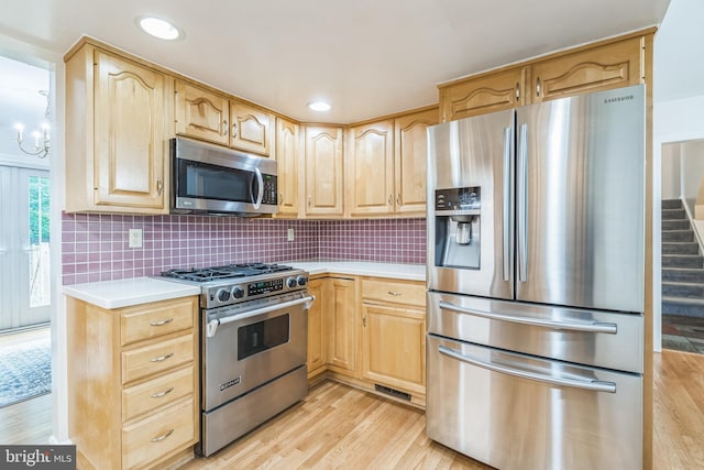 5 Kings House Ct, Silver Spring, MD 20905 - kitchen featuring appliances with stainless steel finishes, light brown cabinets, light countertops, light wood-style flooring, and recessed lighting