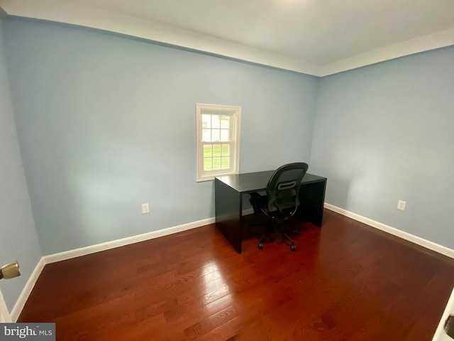 office with dark wood finished floors and baseboards