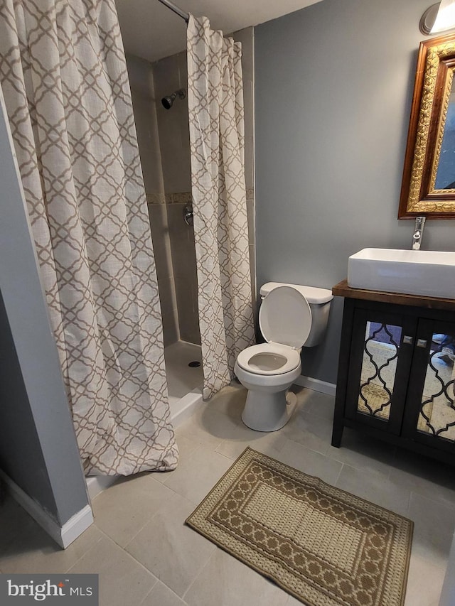 1211 Williamsville Rd, Houston, DE 19954 - bathroom with tile patterned flooring, a shower stall, toilet, and baseboards