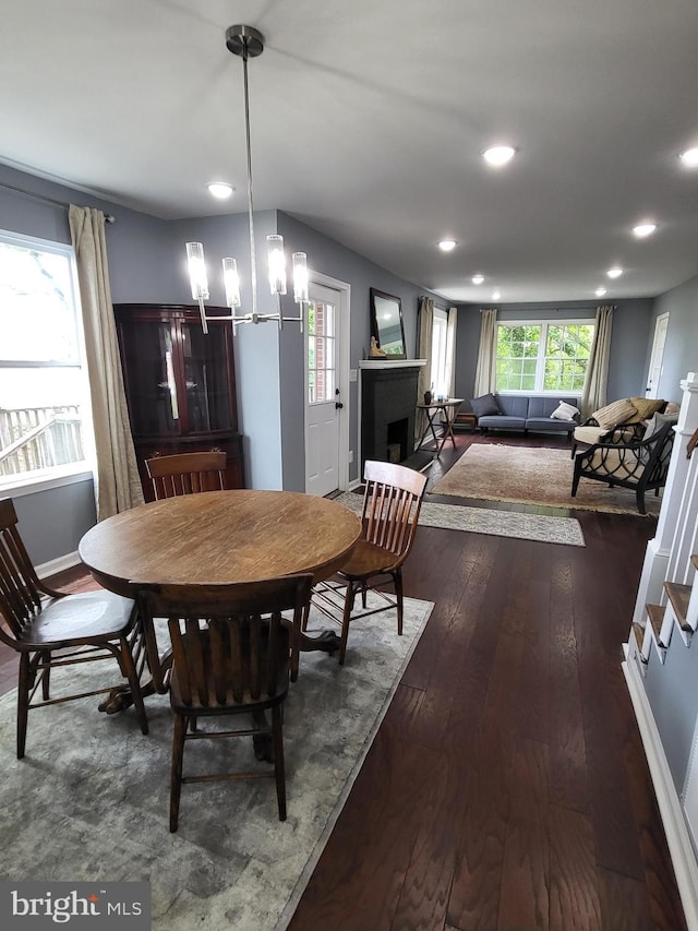 1211 Williamsville Rd, Houston, DE 19954 - dining space featuring a fireplace, recessed lighting, dark wood-style flooring, and baseboards