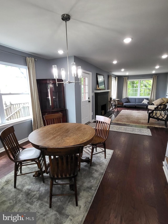 1211 Williamsville Rd, Houston, DE 19954 - dining room with dark wood-style floors, recessed lighting, a chandelier, a fireplace, and baseboards