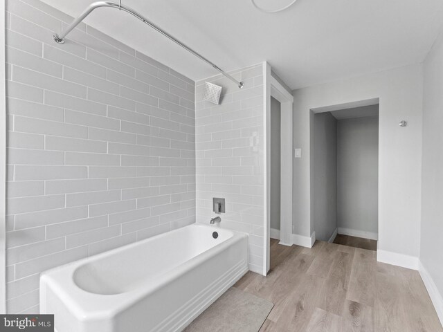 4951 W Thompson St, Philadelphia, PA 19131 - bathroom with wood finished floors, shower / tub combination, and baseboards