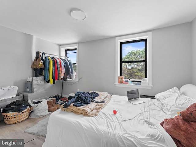 4951 W Thompson St, Philadelphia, PA 19131 - bedroom featuring wood finished floors and multiple windows