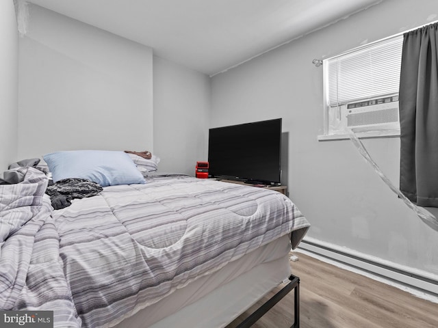 4951 W Thompson St, Philadelphia, PA 19131 - bedroom with wood finished floors and baseboard heating