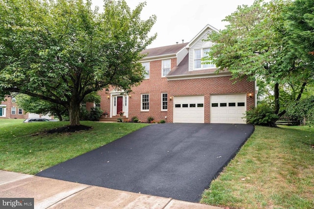 9310 Saffron Hill Ct, Manassas, VA 20110 - view of front facade featuring driveway, brick siding, an attached garage, and a front lawn
