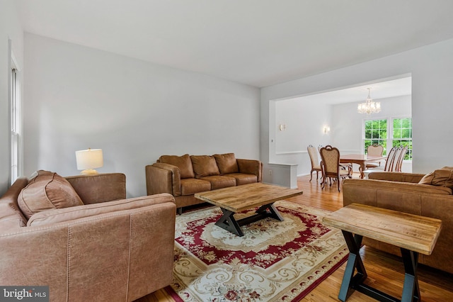 9310 Saffron Hill Ct, Manassas, VA 20110 - living area with light wood-style floors and a chandelier