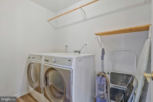 9310 Saffron Hill Ct, Manassas, VA 20110 - washroom featuring washer and clothes dryer, baseboards, wood finished floors, and attic access