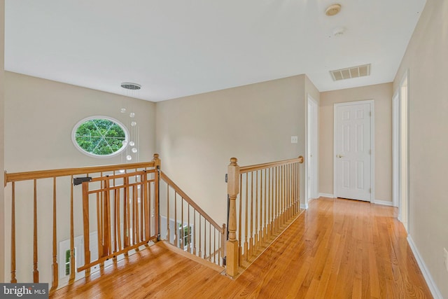 9310 Saffron Hill Ct, Manassas, VA 20110 - corridor with an upstairs landing, wood finished floors, and baseboards