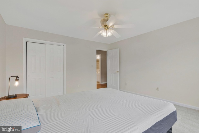 9310 Saffron Hill Ct, Manassas, VA 20110 - bedroom featuring a closet, light carpet, a ceiling fan, and baseboards