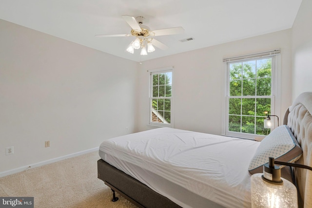 9310 Saffron Hill Ct, Manassas, VA 20110 - carpeted bedroom with baseboards and ceiling fan