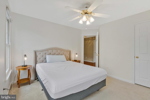 9310 Saffron Hill Ct, Manassas, VA 20110 - bedroom with light carpet, baseboards, and a ceiling fan