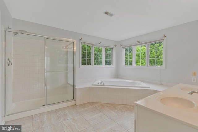 9310 Saffron Hill Ct, Manassas, VA 20110 - bathroom featuring a garden tub, a shower stall, and double vanity