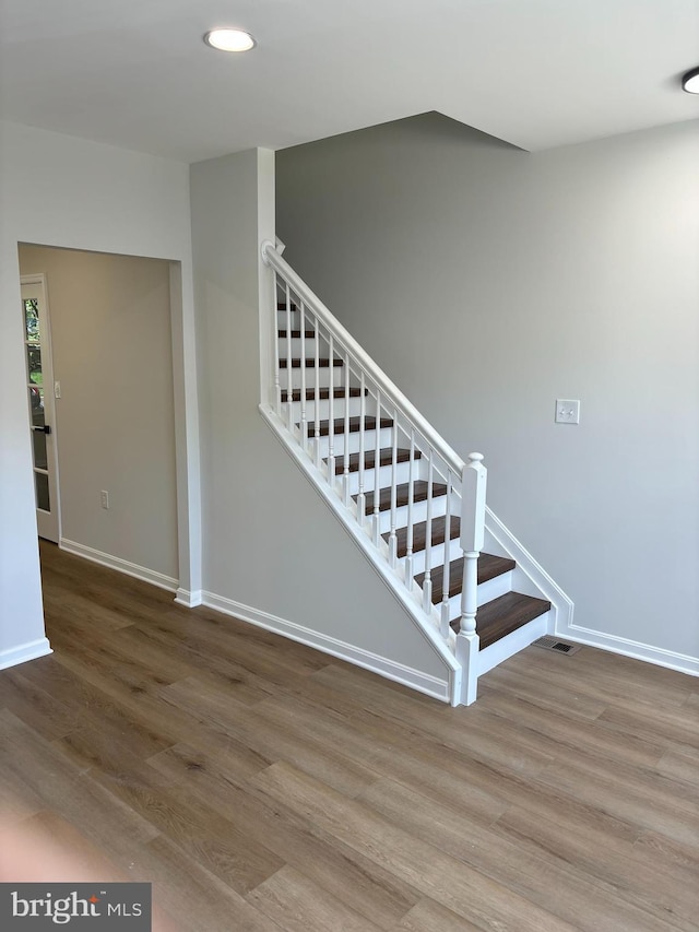 1853TOBIASDRIVESE Tobias Dr SE, Washington, DC 20020 - staircase featuring wood finished floors, baseboards, and recessed lighting