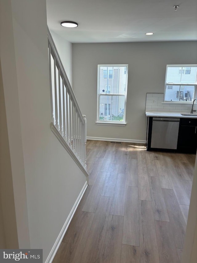 1853TOBIASDRIVESE Tobias Dr SE, Washington, DC 20020 - foyer entrance with wood finished floors, baseboards, and stairs