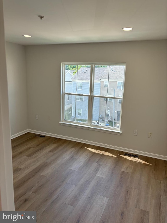1853TOBIASDRIVESE Tobias Dr SE, Washington, DC 20020 - empty room featuring wood finished floors, baseboards, recessed lighting, and a pendent fire sprinkler