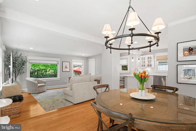 328 Avondale Ave, Haddonfield, NJ 08033 - dining room with light wood finished floors, a chandelier, healthy amount of natural light, ornamental molding, and recessed lighting