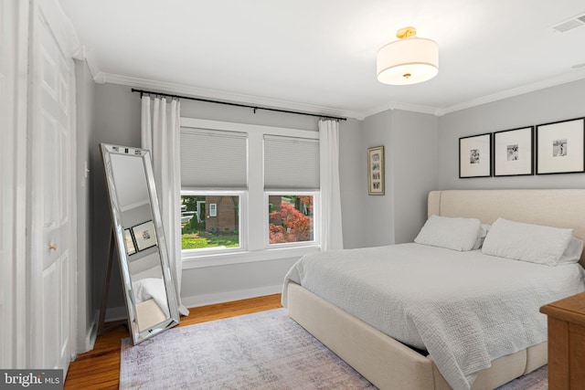 328 Avondale Ave, Haddonfield, NJ 08033 - bedroom featuring ornamental molding, wood finished floors, and baseboards