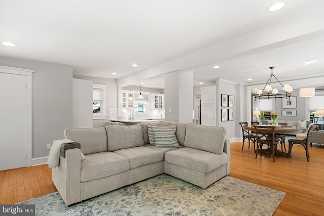 328 Avondale Ave, Haddonfield, NJ 08033 - living room featuring light wood-style floors, recessed lighting, a chandelier, a wall mounted air conditioner, and baseboards