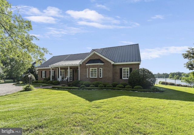 125 Oyster Pt, White Stone, VA 22578 - view of front of house with brick siding, metal roof, and a standing seam roof