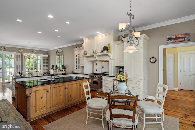 125 Oyster Pt, White Stone, VA 22578 - kitchen featuring a chandelier, high end stainless steel range, wood finished floors, recessed lighting, and crown molding
