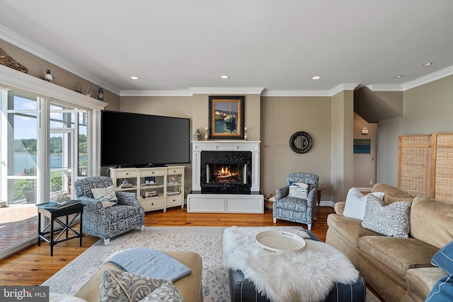 125 Oyster Pt, White Stone, VA 22578 - living area featuring wood finished floors, crown molding, recessed lighting, a fireplace, and baseboards
