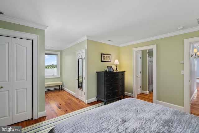 125 Oyster Pt, White Stone, VA 22578 - bedroom featuring ornamental molding, wood finished floors, baseboards, a chandelier, and a closet