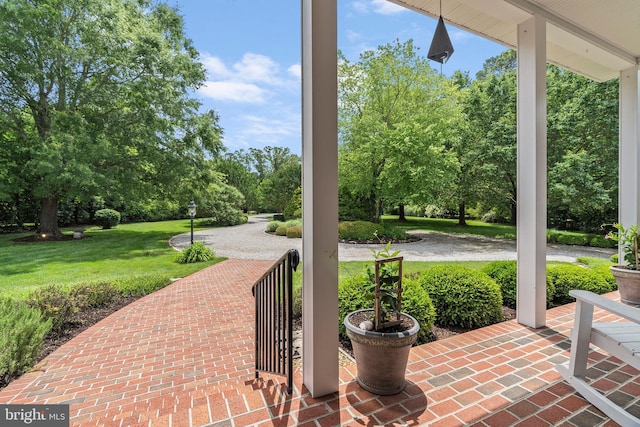 125 Oyster Pt, White Stone, VA 22578 - covered porch with a lawn and view of scattered trees