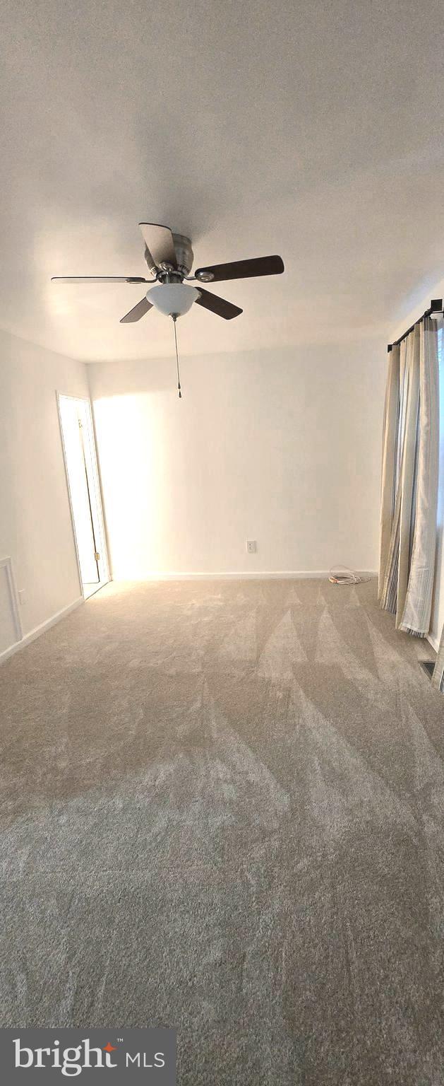 6924 Woodstream Ln, Lanham, MD 20706 - carpeted empty room featuring ceiling fan