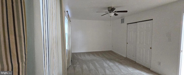 6924 Woodstream Ln, Lanham, MD 20706 - unfurnished bedroom with carpet, baseboards, a closet, and a ceiling fan