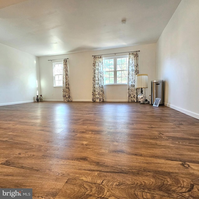 6924 Woodstream Ln, Lanham, MD 20706 - empty room featuring dark wood-style flooring and baseboards