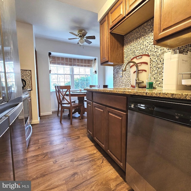 6924 Woodstream Ln, Lanham, MD 20706 - kitchen with dishwasher, a ceiling fan, backsplash, dark wood-style flooring, and light stone countertops