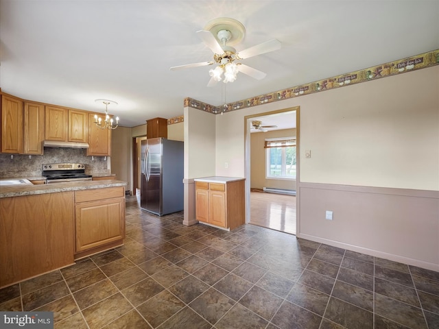 13914 Greencastle Pike, Hagerstown, MD 21740 - kitchen with stainless steel appliances, under cabinet range hood, a ceiling fan, a chandelier, and baseboards