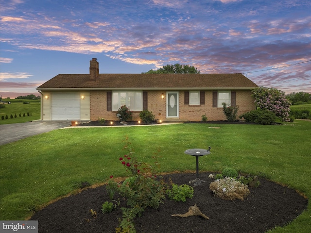 13914 Greencastle Pike, Hagerstown, MD 21740 - ranch-style home with a chimney, asphalt driveway, a front lawn, and an attached garage