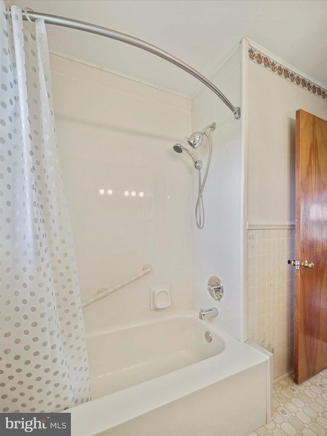 13914 Greencastle Pike, Hagerstown, MD 21740 - bathroom featuring shower / tub combo and wainscoting