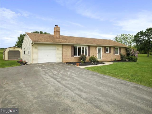 13914 Greencastle Pike, Hagerstown, MD 21740 - single story home with driveway, brick siding, a front lawn, a garage, and a chimney