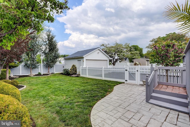 166 Grayson Ave, Hamilton, NJ 08619 - view of yard featuring a gate, an outbuilding, a garage, and a patio area