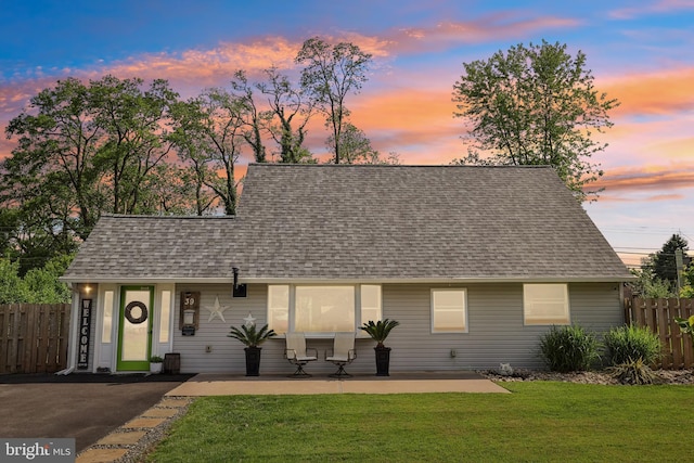 39 Village Ln, Levittown, PA 19054 - view of front facade with a shingled roof and a patio