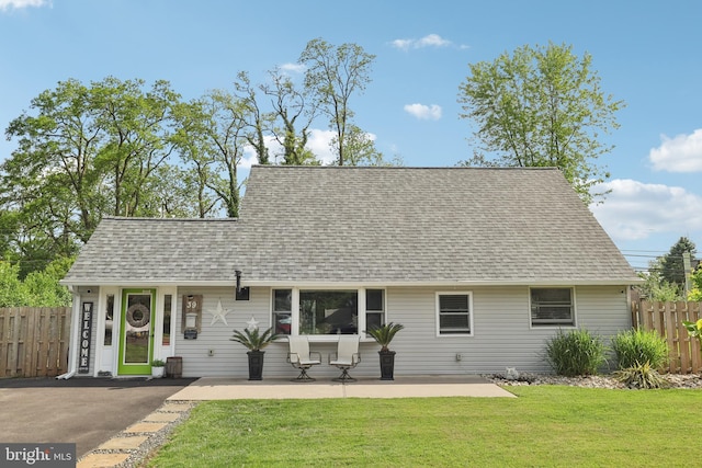 39 Village Ln, Levittown, PA 19054 - view of front of house featuring a shingled roof and a patio
