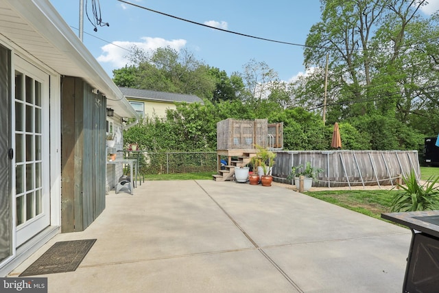 39 Village Ln, Levittown, PA 19054 - fenced backyard featuring a patio and view of wooded area