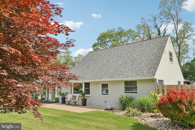 39 Village Ln, Levittown, PA 19054 - back of house with a shingled roof and a patio area