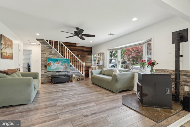 39 Village Ln, Levittown, PA 19054 - living room with a wood stove, stairway, ceiling fan, wood finished floors, and recessed lighting
