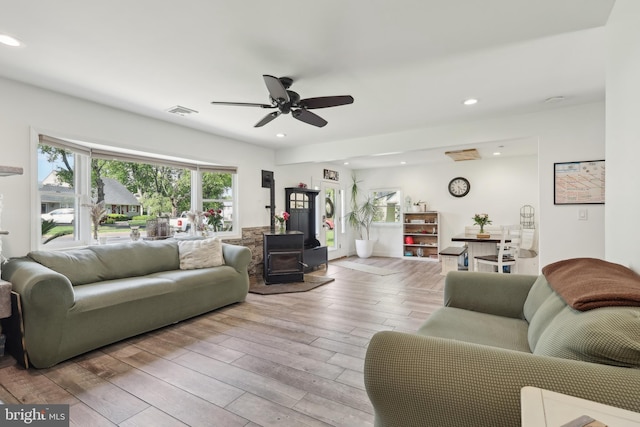39 Village Ln, Levittown, PA 19054 - living room featuring recessed lighting, wood finished floors, ceiling fan, and a wood stove