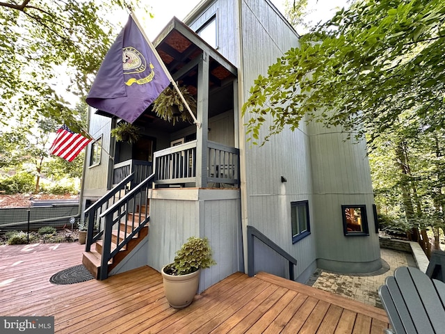 wooden terrace featuring stairway