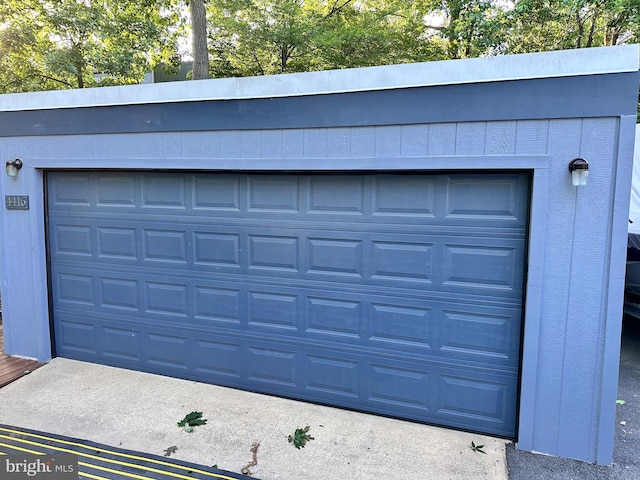 garage featuring driveway
