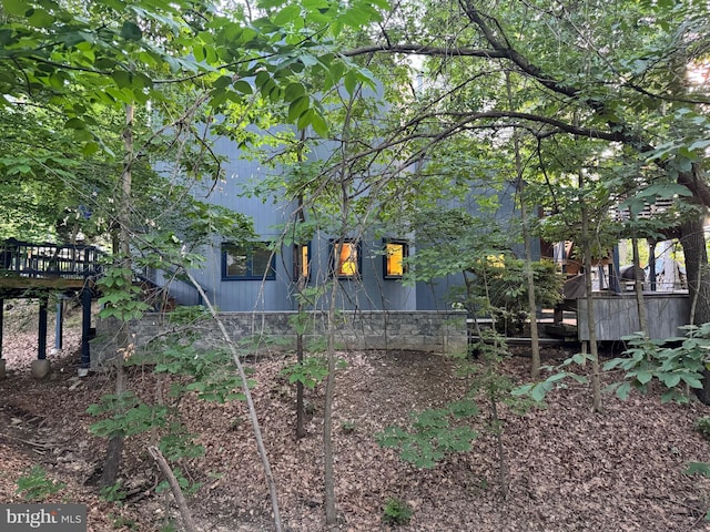 rear view of property with a deck