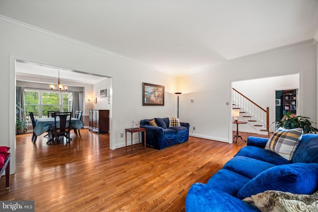 5 Craig Ln, Malvern, PA 19355 - living room with crown molding, a chandelier, wood finished floors, stairway, and baseboards