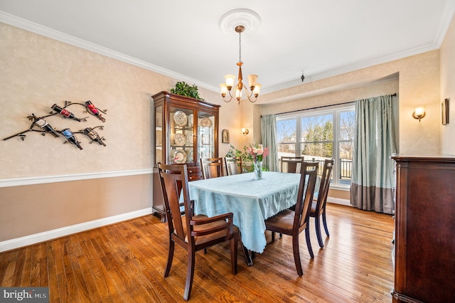 5 Craig Ln, Malvern, PA 19355 - dining room featuring a chandelier, wood finished floors, crown molding, and baseboards