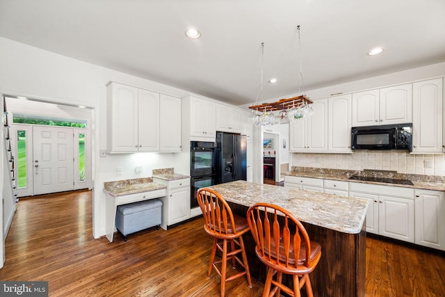 5 Craig Ln, Malvern, PA 19355 - kitchen featuring black appliances, a kitchen island, dark wood finished floors, white cabinets, and recessed lighting