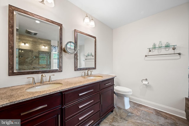 5 Craig Ln, Malvern, PA 19355 - bathroom with double vanity, a stall shower, toilet, and baseboards